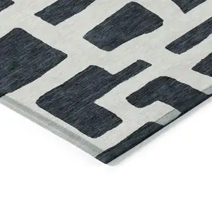 Photo of Black And Ivory Abstract Washable Indoor Outdoor Area Rug