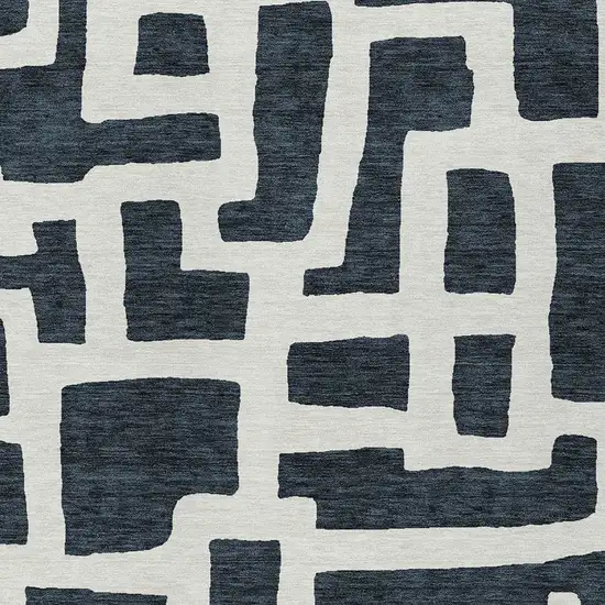 Black And Ivory Abstract Washable Indoor Outdoor Area Rug Photo 6