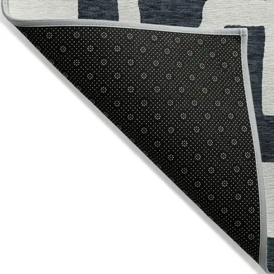 Black And Ivory Abstract Washable Indoor Outdoor Area Rug Photo 4