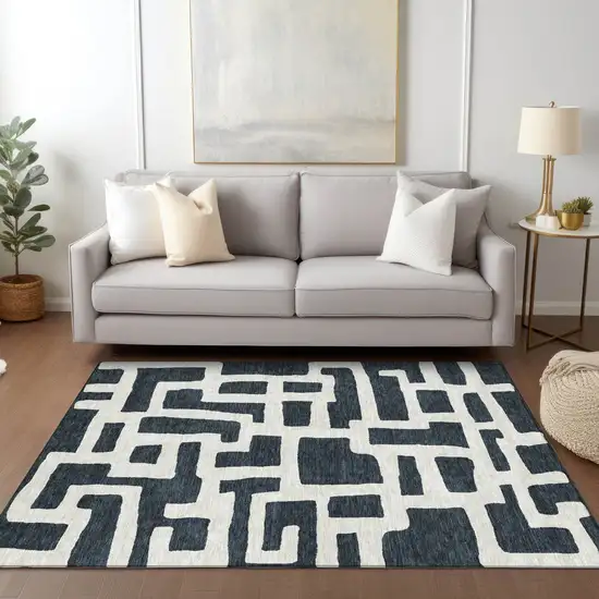 Black And Ivory Abstract Washable Indoor Outdoor Area Rug Photo 9