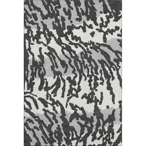 Photo of Black And Ivory Animal Print Washable Area Rug With UV Protection