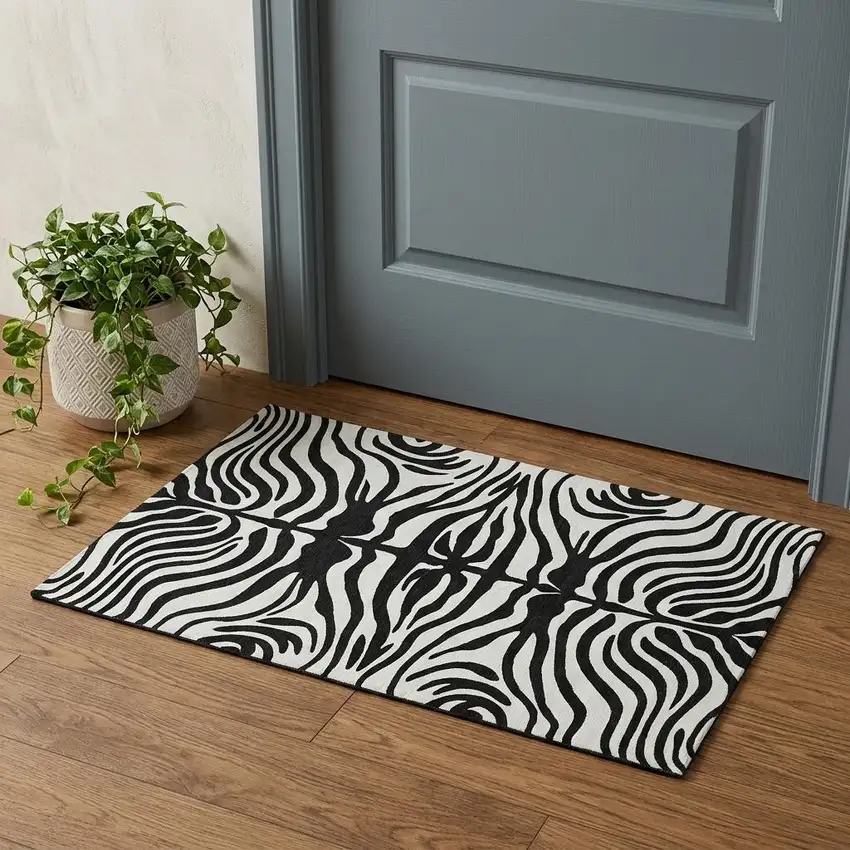 Black And Ivory Animal Print Washable Area Rug With UV Protection Photo 1