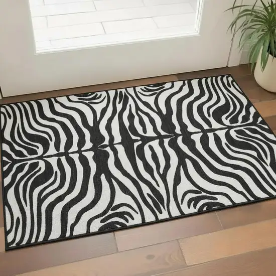 Black And Ivory Animal Print Washable Area Rug With UV Protection Photo 2