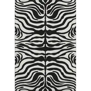 Photo of Black And Ivory Animal Print Washable Area Rug With UV Protection