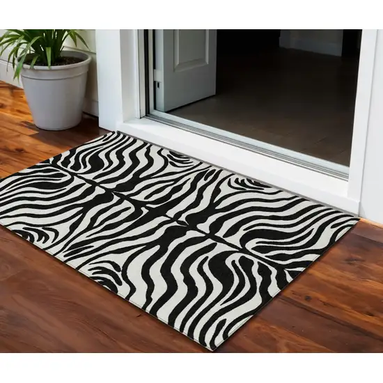 Black And Ivory Animal Print Washable Indoor Outdoor Area Rug Photo 1