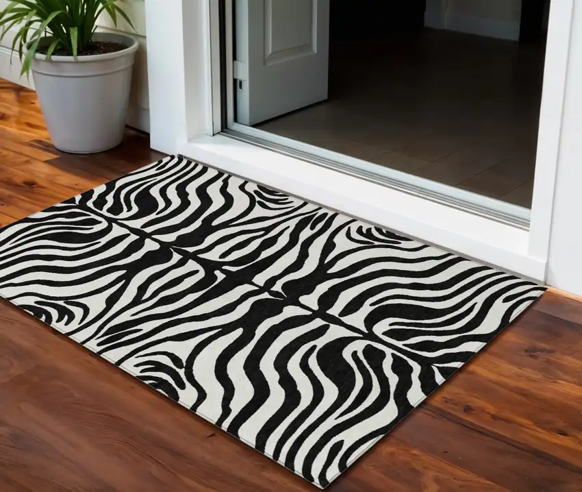 Black And Ivory Animal Print Washable Indoor Outdoor Area Rug Photo 1