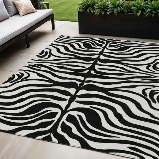 Black And Ivory Animal Print Washable Indoor Outdoor Area Rug Photo 1