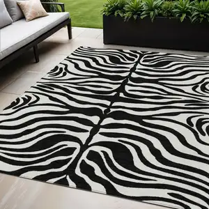 Photo of Black And Ivory Animal Print Washable Indoor Outdoor Area Rug