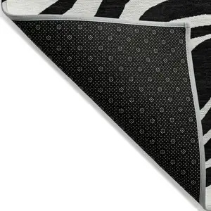 Photo of Black And Ivory Animal Print Washable Indoor Outdoor Area Rug