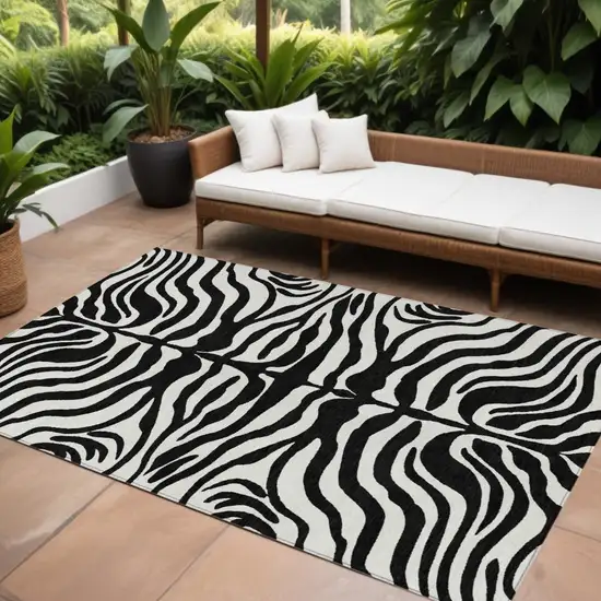 Black And Ivory Animal Print Washable Indoor Outdoor Area Rug Photo 1