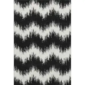 Photo of Black And Ivory Chevron Washable Area Rug With UV Protection