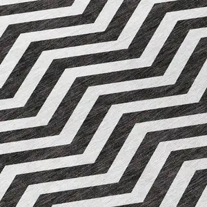 Photo of Black And Ivory Chevron Washable Indoor Outdoor Area Rug