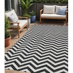 Photo of Black And Ivory Chevron Washable Indoor Outdoor Area Rug