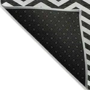 Photo of Black And Ivory Chevron Washable Indoor Outdoor Area Rug
