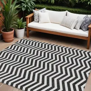 Photo of Black And Ivory Chevron Washable Indoor Outdoor Area Rug