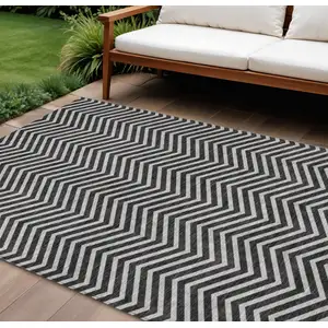 Photo of Black And Ivory Chevron Washable Indoor Outdoor Area Rug