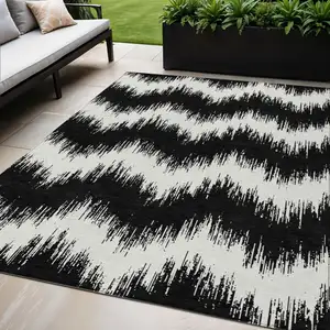 Photo of Black And Ivory Chevron Washable Indoor Outdoor Area Rug