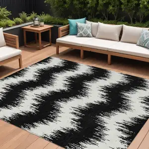 Photo of Black And Ivory Chevron Washable Indoor Outdoor Area Rug