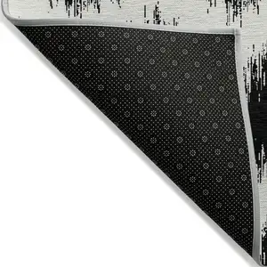Photo of Black And Ivory Chevron Washable Indoor Outdoor Area Rug