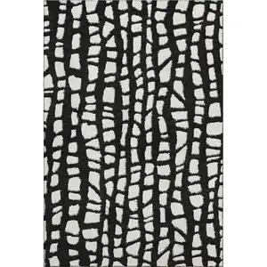 Photo of Black And Ivory Cobblestone Washable Area Rug With UV Protection