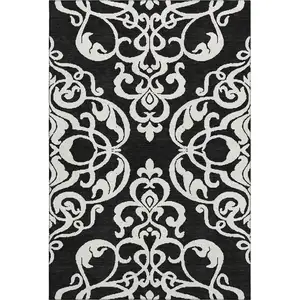 Photo of Black And Ivory Damask Washable Area Rug With UV Protection