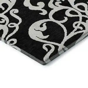 Photo of Black And Ivory Damask Washable Area Rug With UV Protection