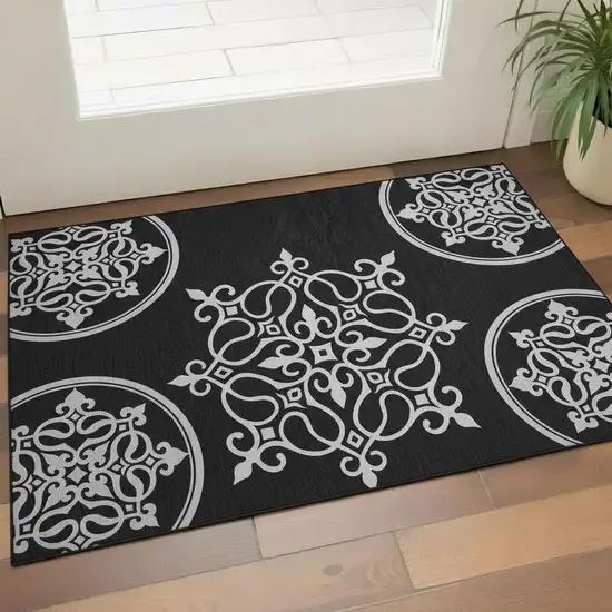 Black And Ivory Floral Medallion Washable Area Rug With UV Protection Photo 1