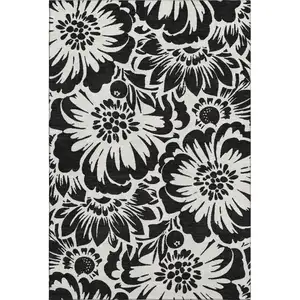 Photo of Black And Ivory Floral Washable Area Rug With UV Protection