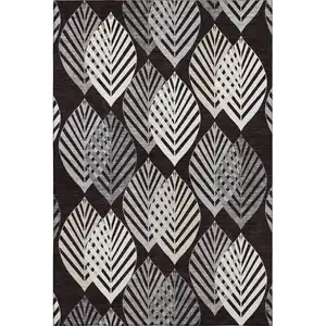 Photo of Black And Ivory Floral Washable Area Rug With UV Protection