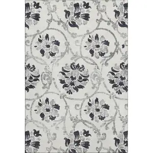 Photo of Black And Ivory Floral Washable Area Rug With UV Protection