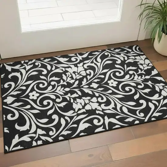 Black And Ivory Floral Washable Area Rug With UV Protection Photo 1