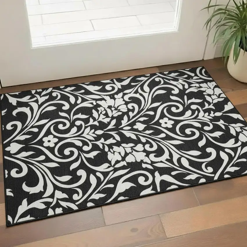 Black And Ivory Floral Washable Area Rug With UV Protection Photo 1