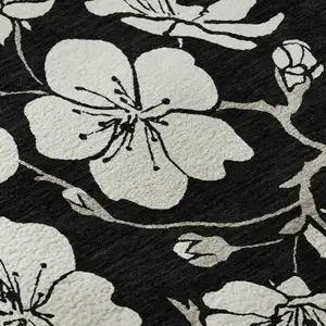 Photo of Black And Ivory Floral Washable Area Rug With UV Protection