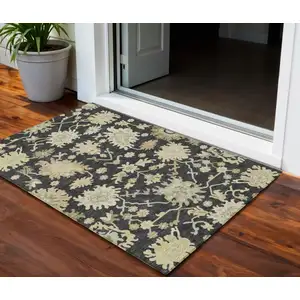 Photo of Black And Ivory Floral Washable Indoor Outdoor Area Rug