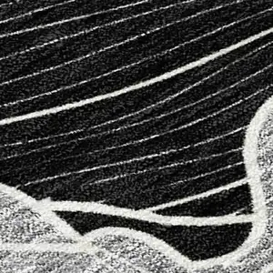 Photo of Black And Ivory Floral Washable Indoor Outdoor Area Rug