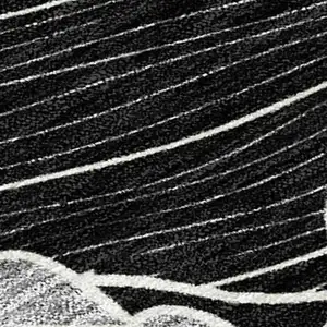 Photo of Black And Ivory Floral Washable Indoor Outdoor Area Rug