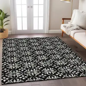 Photo of Black And Ivory Floral Washable Indoor Outdoor Area Rug