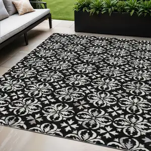 Photo of Black And Ivory Floral Washable Indoor Outdoor Area Rug
