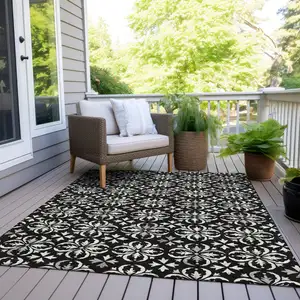 Photo of Black And Ivory Floral Washable Indoor Outdoor Area Rug