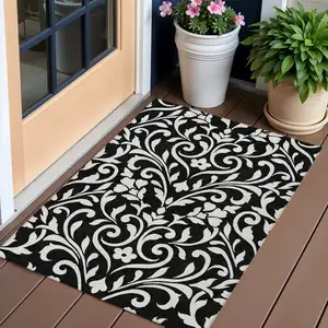 Photo of Black And Ivory Floral Washable Indoor Outdoor Area Rug