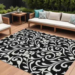 Photo of Black And Ivory Floral Washable Indoor Outdoor Area Rug