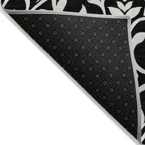 Photo of Black And Ivory Floral Washable Indoor Outdoor Area Rug