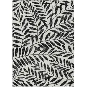 Photo of Black And Ivory Floral Washable Indoor Outdoor Area Rug