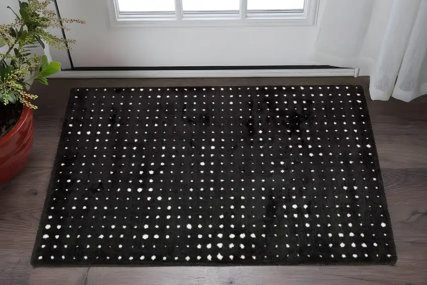 Black And Ivory Geometric Area Rug Photo 1
