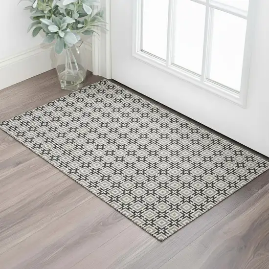 Black And Ivory Geometric Washable Area Rug With UV Protection Photo 1
