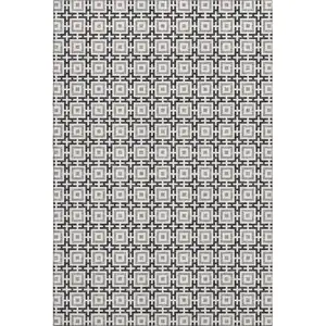 Photo of Black And Ivory Geometric Washable Area Rug With UV Protection