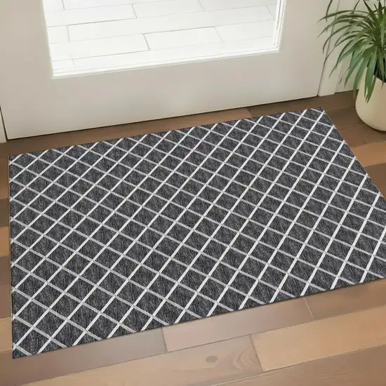Black And Ivory Geometric Washable Area Rug With UV Protection Photo 1