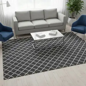 Photo of Black And Ivory Geometric Washable Area Rug With UV Protection