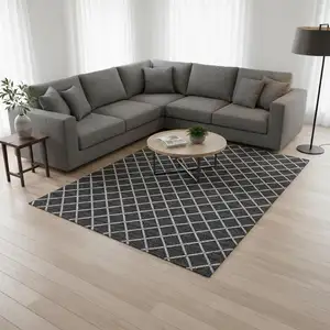 Photo of Black And Ivory Geometric Washable Area Rug With UV Protection