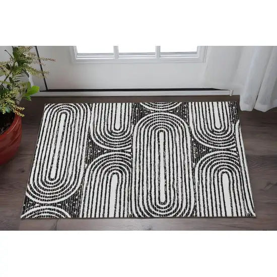 Black And Ivory Geometric Washable Area Rug With UV Protection Photo 2